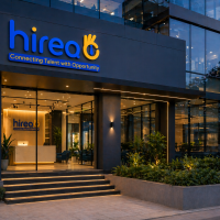 Hireo recruitment company office exterior with modern glass building and illuminated entrance